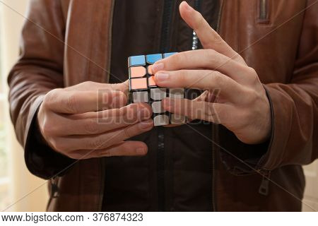 A Man Playing With A Rubix Cube, Taken 3rd March 2020 In Burford In The Uk