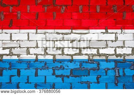 The National Flag Of Luxembourg Painted On A Wall Of Sibit Blocks With Cement . The Symbol Of The Co