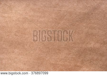 Textured Craft Surface. Brown Paper Sheet Texture Background Or Cardboard Surface From Box For Packi