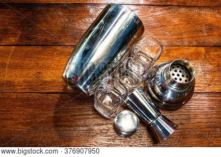 Bar Ustensils, Drink Concept. Cocktail Shaker Accessories On A Wooden Board.
