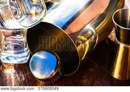 Bar Ustensils, Drink Concept. Cocktail Shaker Accessories On A Wooden Board.