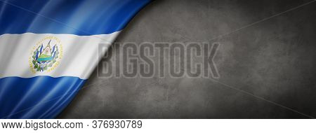 El Salvador Flag On Concrete Wall. Horizontal Panoramic Banner. 3d Illustration