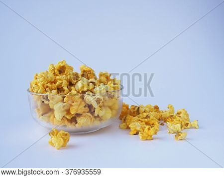 Popcorn In Bowl On White Background.snack Food Concept.