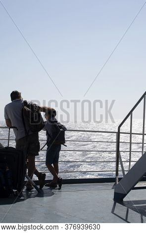 Aegean Sea / Greece / September 15 2019 : Father And Son On The Deck Of An Inter Island Ferry, On A 