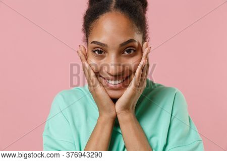 Close Up Of Charming Young African American Woman Girl In Green Sweatshirt Posing Isolated On Pastel