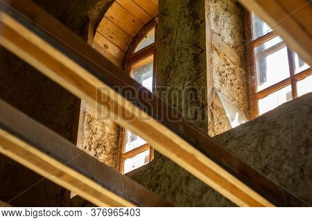 Structures And Windows Of A Wooden Ecohouse With Clay Plaster. Bottom View