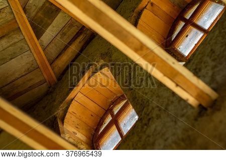 Structures And Windows Of A Wooden Ecohouse With Clay Plaster. Bottom View