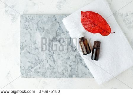 Autumn Falll Seasonal Spa Set Massage Essential Oils, Towels On Gray Marble Plate, Organic Cosmetic 