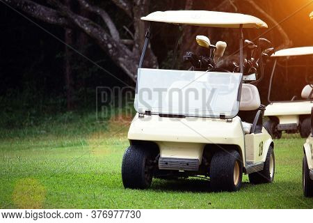 Golfcar In Beautiful Golf Course In The Evening Golf Course With Sunshine In Thailand
