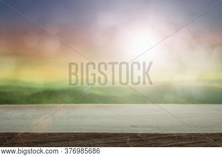 Empty Wooden Table Top On Natural Background Blurring Warm Colors And Bright Sun Light, Blur Pastel 