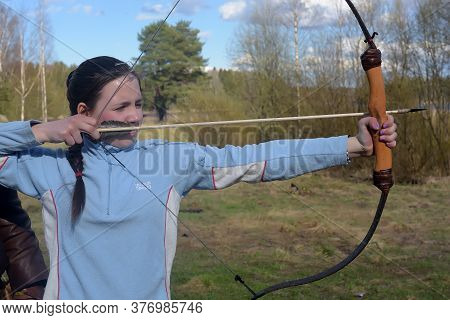 Russia, St. Petersburg 24,05,2017 A Girl Shoots From A Bow At The Festival Of Medieval Culture 