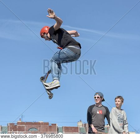 Russia, St. Petersburg, 10,05,2015.boy On Scooter Flips In The Air, The Youth Festival Of Extreme Sp