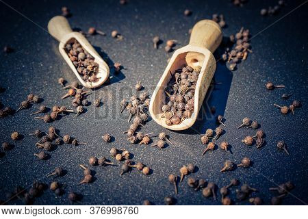 Peppercorns Of Piper Cubeba With A Wooden Spoon