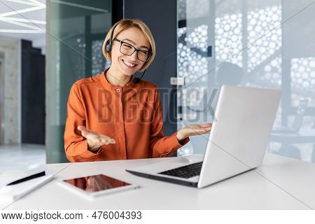 Businesswoman With Video Call Headset Talking To Customers Remotely, Female Worker Smiling And Advis