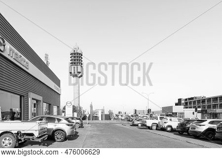 Kimberley, South Africa - Feb 24, 2022: A Street Scene, With Vehicles And Businesses Visible, In Kim