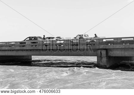 Upington, South Africa - Feb 24, 2023: Sightseers On Road Bridge Over A Flooded Orange River At Upin