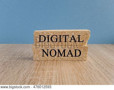 Digital Nomad Symbol. Brick Blocks With Words Digital Nomad On Beautiful Blue Background, Copy Space