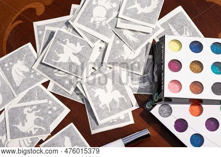 All The Material Ready On The Table For Making Shimmering Sparkling Glitter Tattoo For Children At A