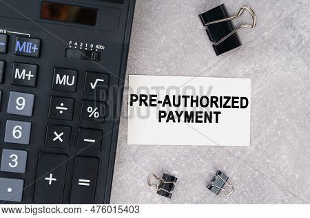 Business Concept. On A Gray Surface Lies A Calculator, A Pen And A Business Card With The Inscriptio
