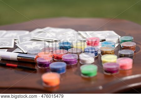 All The Material Ready On The Table For Making Shimmering Sparkling Glitter Tattoo For Children At A
