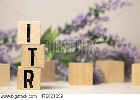 Wooden Blocks With The Inscription Itr On Office Desk.