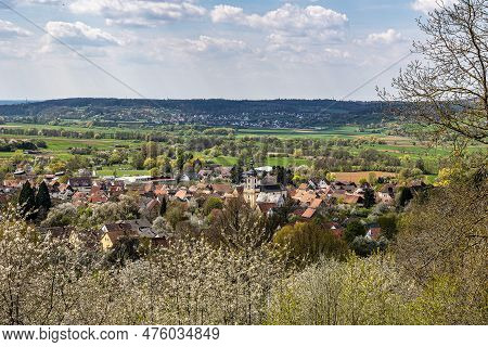 Church Of Saint Kilian At Pretzfeld, Germany In Franconian Switzerland Through Twigs And Branches Of
