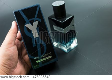 Samut Prakan, Thailand - May 9, 2023 : Man Hand Holding A Box Of Perfumery Yves Saint Laurent Y Eau 