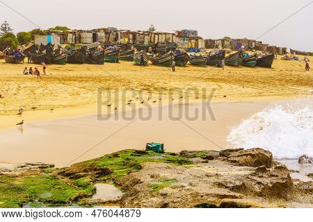 Oualidia, Morocco - April 08, 2023: Beach Scene, With Locals And Visitors, In The Village Resort Oua