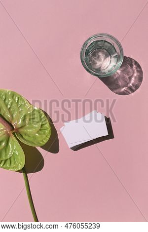 Business Card White Mosk Up On The Colorful Pink Background With Tropical Flower Flat Lay. Top View.