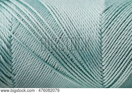 Macro Texture Of Blue Silk Luxury Thread, Close-up, Copy Space. Macro Photography Of A Coil With Thr