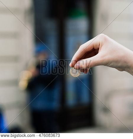 Street Old Performer Musician Plays Saxofon Blurred, Coin In Hand Focused