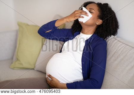 Sad Millennial African American Pregnant Woman With Big Belly Suffers From Illness And Health Proble