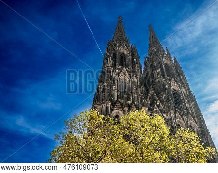 Cologne Cathedral Seen From Below With Blue Sky. Cologne Cathedral, Or Kolner Dom, Is The Main Landm