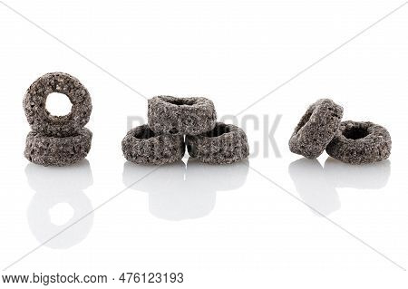 Heap Of Black Cereal Rings Isolated On White Background, Delicious And Useful Rings Breakfast Cereal
