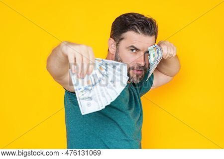 Portrait Of Lucky Man Holding Cash Dollar Bills On Yellow Studio. Big Luck, Banner. Dollar Cash Mone