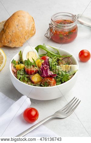 Salad With Boiled Eggs, Cherry Tomatoes, Aragula, Cabbage And Potatoes.