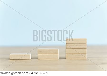 Growth, Target, Upskill Concept. Growth Of Wooden Cubes On A Clean Background. Business, Economics, 