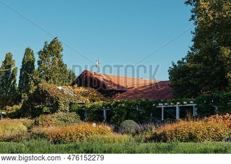 House With Nice Garden In Fall. Flowers In The City Park Of Bietigheim-bissingen, Baden-wuerttemberg