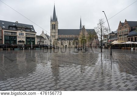 Geel, Flanders, Belgium - April 22, 2023 - Buildings In The Rain At The Old Market Square