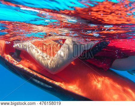 A Boy In A Life Jacket Swims With Underwater Scooter Seabob. Close-up.