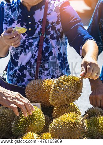 Elderly Thai Female Vendor Ride Motorcycle Selling Durians And Fruits And Vegetables To Tourists At