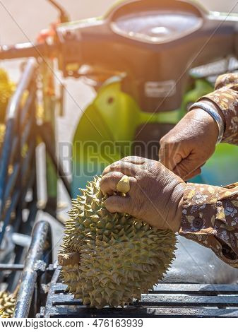 Elderly Thai Female Vendor Ride Motorcycle Selling Durians And Fruits And Vegetables To Tourists At