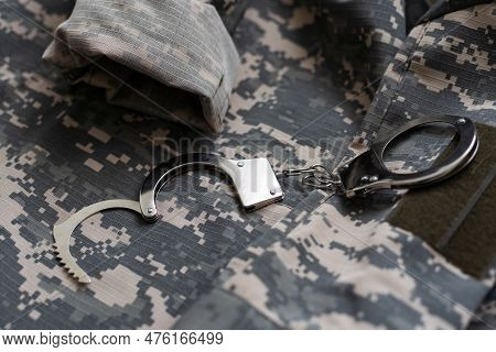 A Military Camouflage, Handcuffed. Concept: War Criminal, Prisoner Of War, Tribunal For Deserters, T