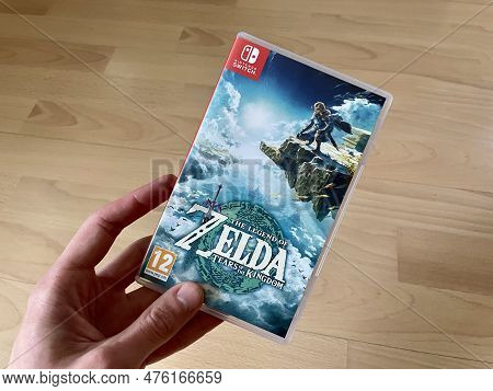 Prague, Czech Republic - May 11 2023: The Legend Of Zelda: Tears Of The Kingdom Case Held By A Mans 