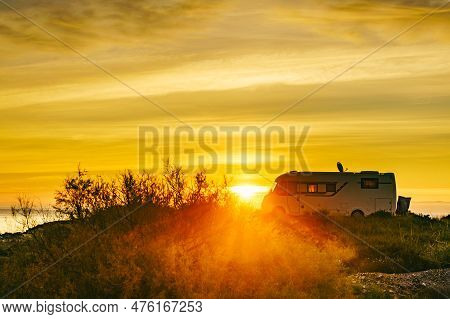 Caravan On Sea At Sunrise.
