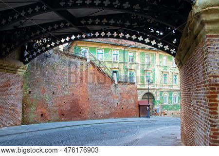Beautiful Old Street Passing Under The Bridge Of Lies, (podul Minciunilor) In The Old City Of Sibiu,