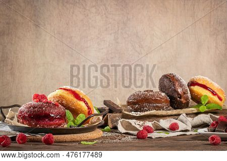 Bolas De Berlim, Or Berlin Balls. Portuguese Fried Dough With Sugar, Filled With Chocolate Or Raspbe