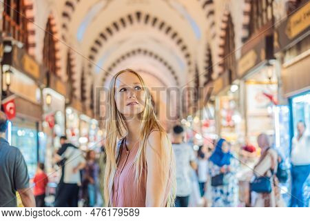A Tourist Woman Walks Among The Countless Shops At The Grand Bazaar And Egyptian Bazaar In Istanbul.