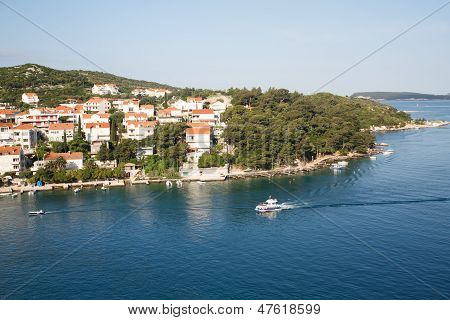 Pilot Boat Past Homes In Croatia