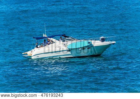 La Spezia, Italy - July 27, 2022: White Luxury Motor Boat In The Blue Mediterranean Sea With People 